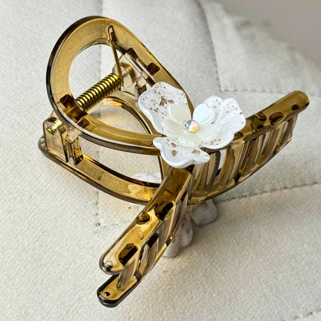 Decorative floral hair claw clip to elevate casual or dressy hairstyles.