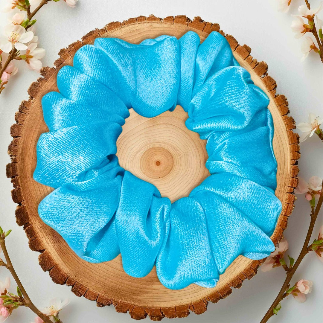 Bold oversized blue scrunchie to add volume and style to ponytails.
