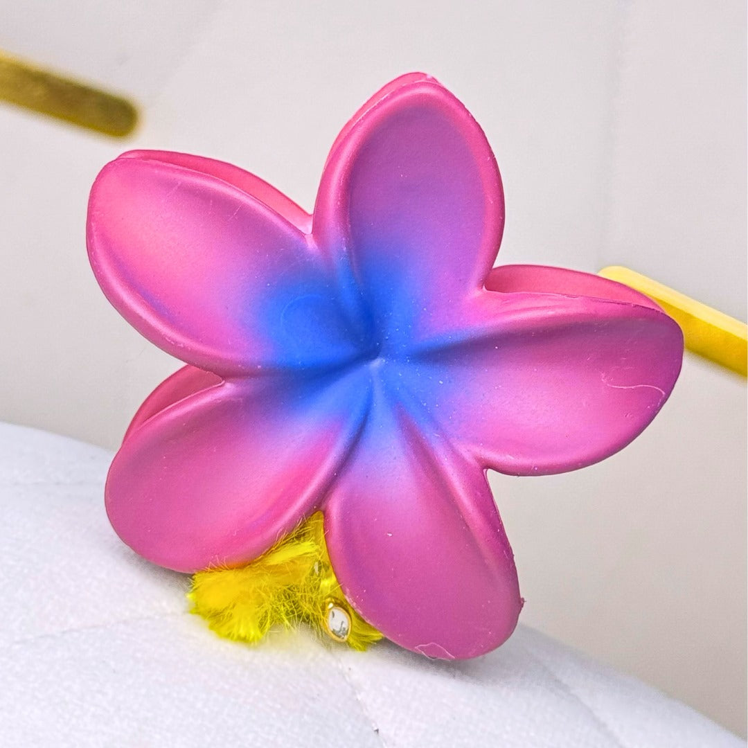 Glossy two-tone hair clutcher offering a chic contrast finish for trendy hairstyles.