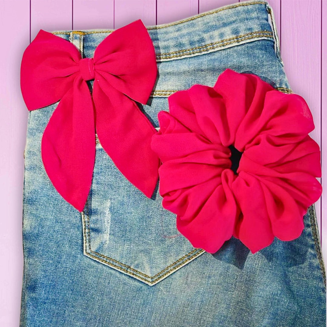Vibrant hot pink scrunchie with bow, perfect for bold and playful hairstyles.