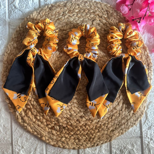 Pixie Pins Printed Tail Scrunchies – Trendy ribbon-style scrunchies with colorful prints for a chic, secure hairstyle